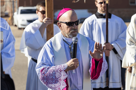 Archbishop Samuel J. Aquila speaks outside the ICE facility in Aurora
